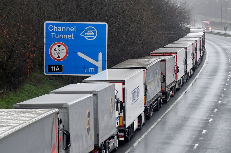 &copy; Reuters. FILE PHOTO: Lorries are parked on the M20 motorway towards Eurotunnel and the Port of Dover