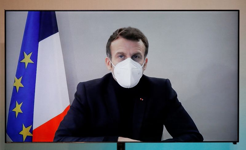 &copy; Reuters. French President Macron, tested positive for coronavirus, talks by video conference in Paris