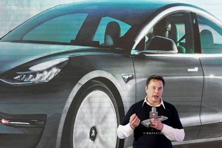 Musk tweets he reached out to Apple's Tim Cook for acquiring Tesla By Reuters