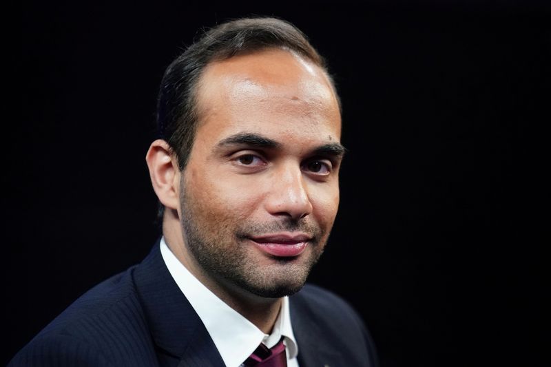 © Reuters. FILE PHOTO: George Papadopoulos poses for a photo before a TV interview in New York