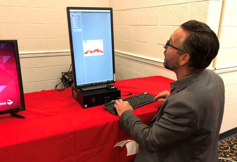 &copy; Reuters. FILE PHOTO:  Eric Cooper, director of product strategy for Dominion Voting Systems, demonstrates one of the company&apos;s voting machines in Harrisburg