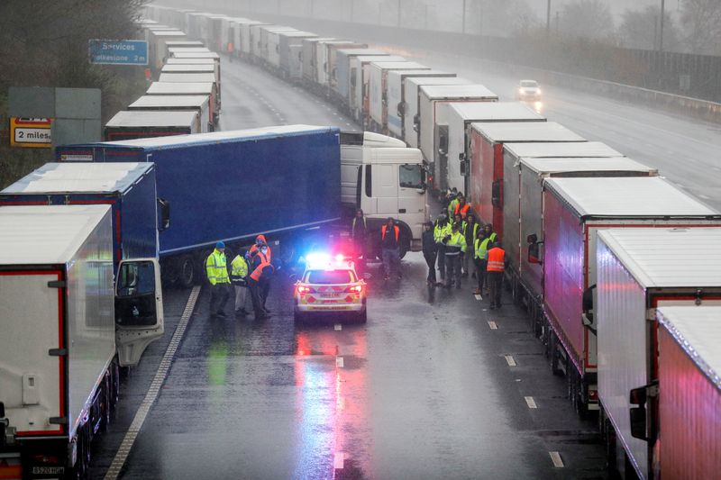 &copy; Reuters. FILE PHOTO: Lorries are parked on M20 motorway near Ashford