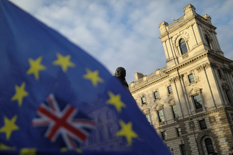 &copy; Reuters. FILE PHOTO: A flag is seen outside the Houses of Parliament near the statue of former Prime Minister Winston Churchill in London