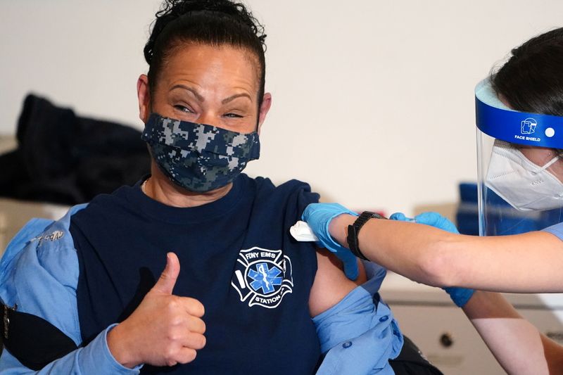 &copy; Reuters. Workers of the FDNY EMS receive COVID-19 Moderna vaccine in New York