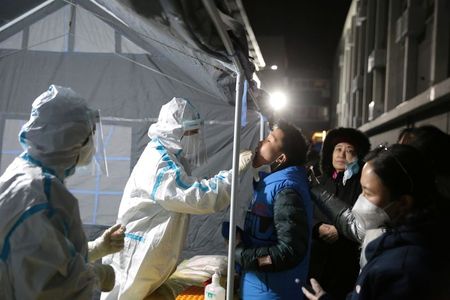 China reports 20 new COVID-19 mainland cases vs 14 a day earlier By Reuters