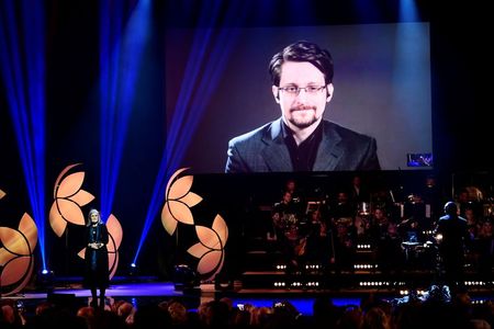 U.S. whistleblower Edward Snowden's wife shares photos of their new son By Reuters