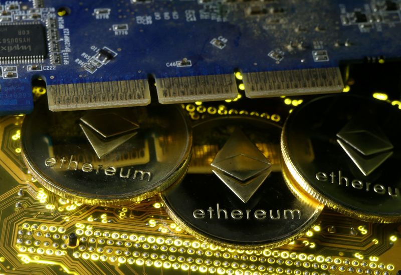 © Reuters. FILE PHOTO: Representations of the Ethereum virtual currency standing on the PC motherboard are seen in this illustration picture