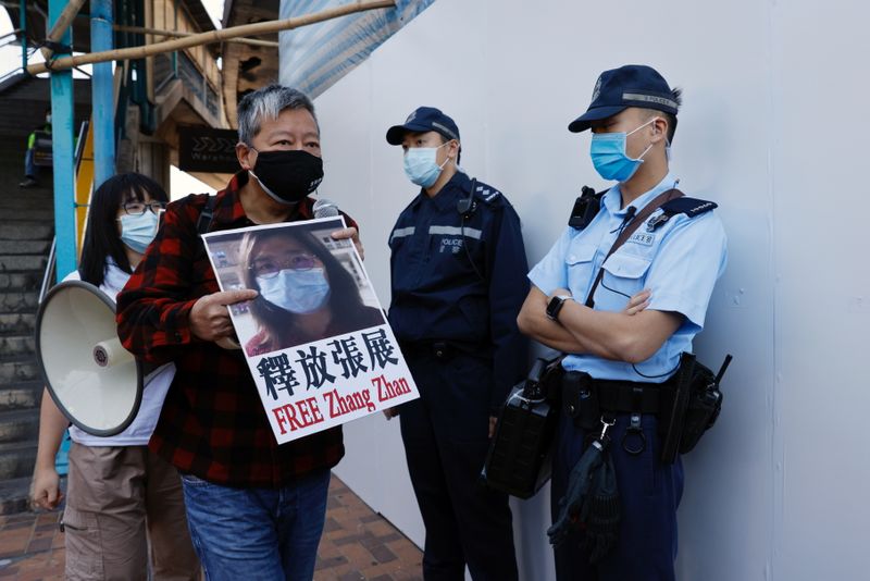 &copy; Reuters. Pro-democracy supporters protest to urge for the release of 12 Hong Kong activists arrested as they reportedly sailed to Taiwan for political asylum and citizen journalist Zhang Zhan outside China&apos;s Liaison Office, in Hong Kong