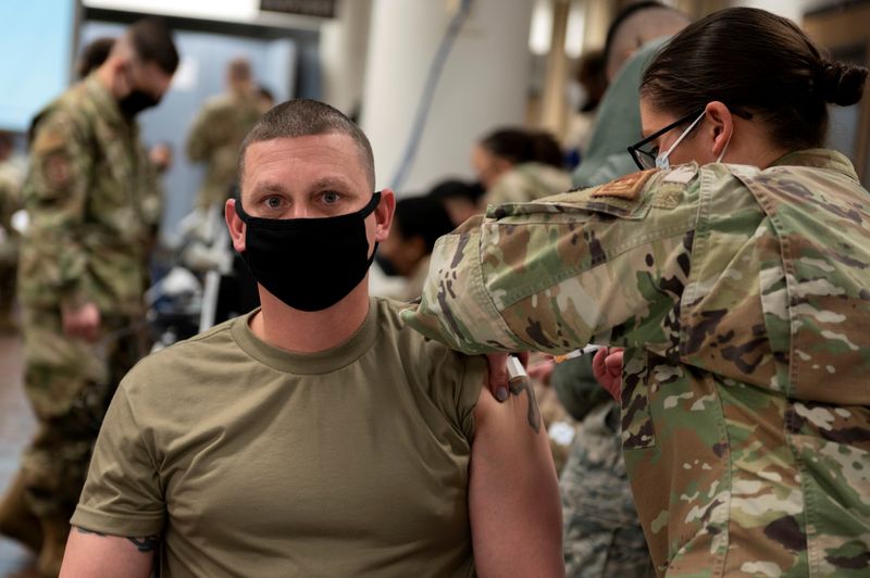 © Reuters. A U.S. Air Force soldier gets a coronavirus disease (COVID-19) vaccine at Osan Air Base in Pyeongtaek