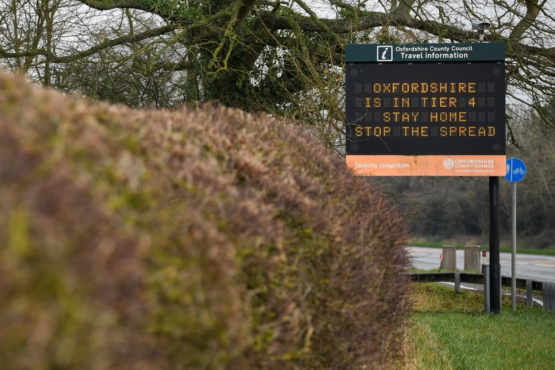 &copy; Reuters. A roadside sign displays a public health information message, amidst the spread of the coronavirus disease (COVID-19) pandemic, near Oxford