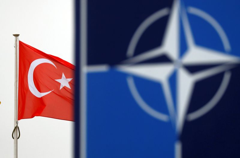 &copy; Reuters. FILE PHOTO: A Turkish flag flies next to NATO logo at the Alliance headquarters in Brussels