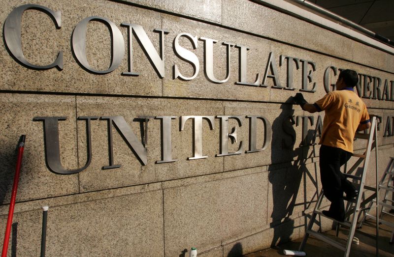 &copy; Reuters. FILE PHOTO: A worker cleans the front wall of the US Consulate General in Hong Kong