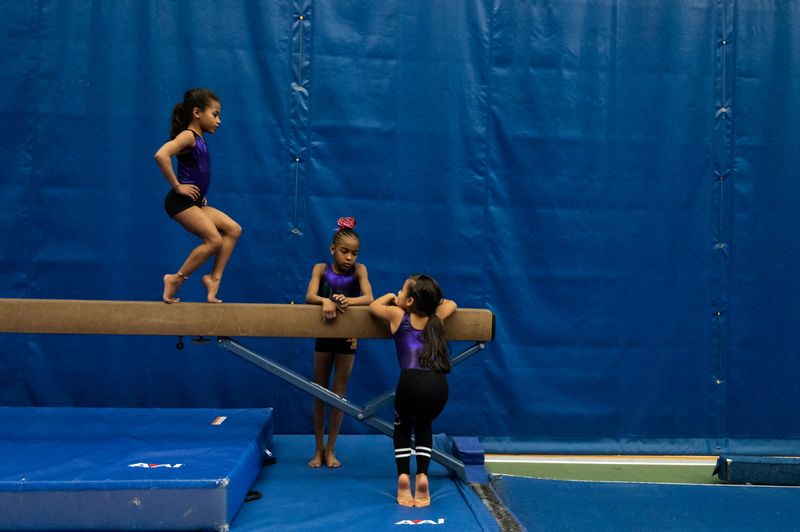 © Reuters. The Wider Image: In Simone Biles' path, a fearless young gymnast learns new 2020 routine