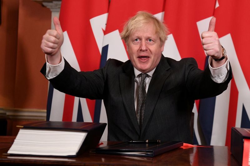 &copy; Reuters. FILE PHOTO: Britain&apos;s Prime Minister Boris Johnson signs the Brexit trade deal with EU