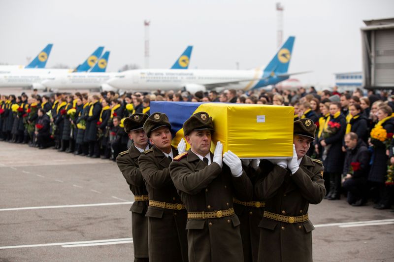 © Reuters. FILE PHOTO: Memorial ceremony for the Ukrainian victims of Iran plane crash at the Boryspil International Airport, outside Kiev