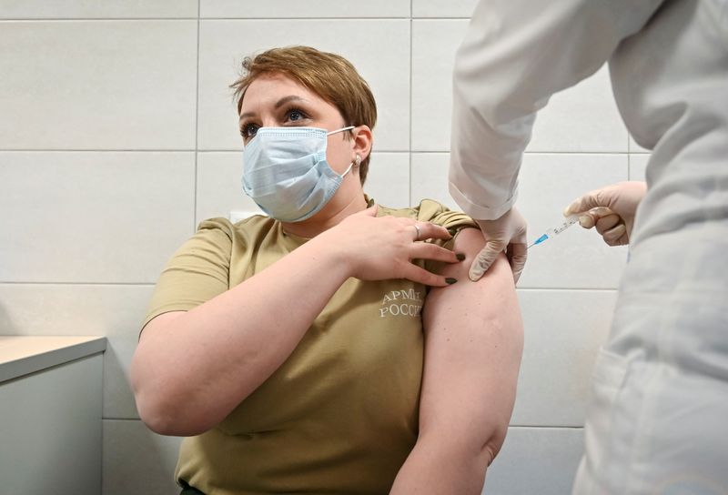 &copy; Reuters. FILE PHOTO: A Russian Army service member receives an injection with Sputnik V (Gam-COVID-Vac) vaccine against the coronavirus disease (COVID-19) at a clinic in the city of Rostov-On-Don