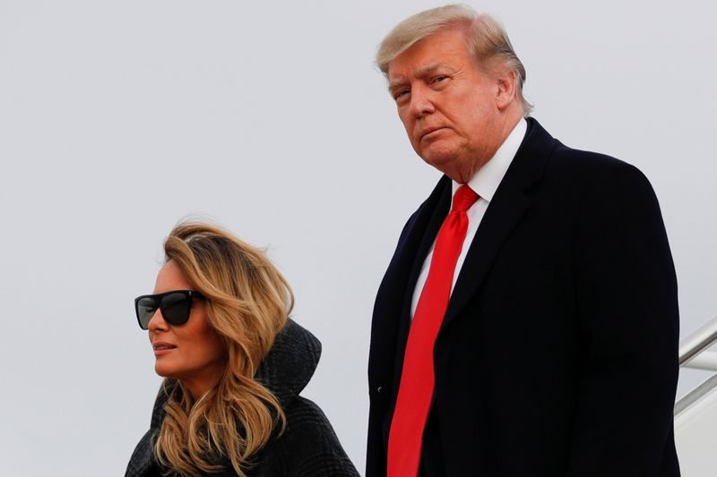 &copy; Reuters. President Trump and first lady Melania Trump descend from Air Force One at Joint Base Andrews in Maryland