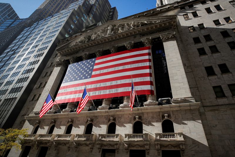 &copy; Reuters. FILE PHOTO: The U.S. flag covers the front facade of the NYSE in New York