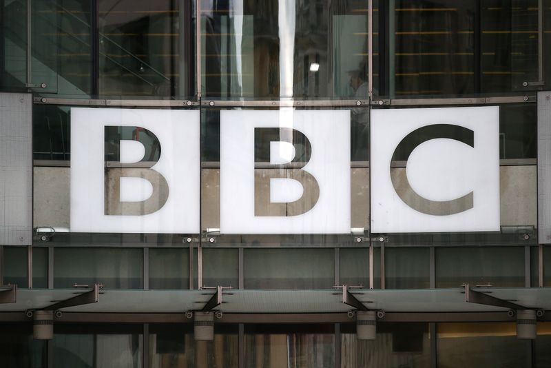 &copy; Reuters. A BBC sign is displayed outside Broadcasting House in London