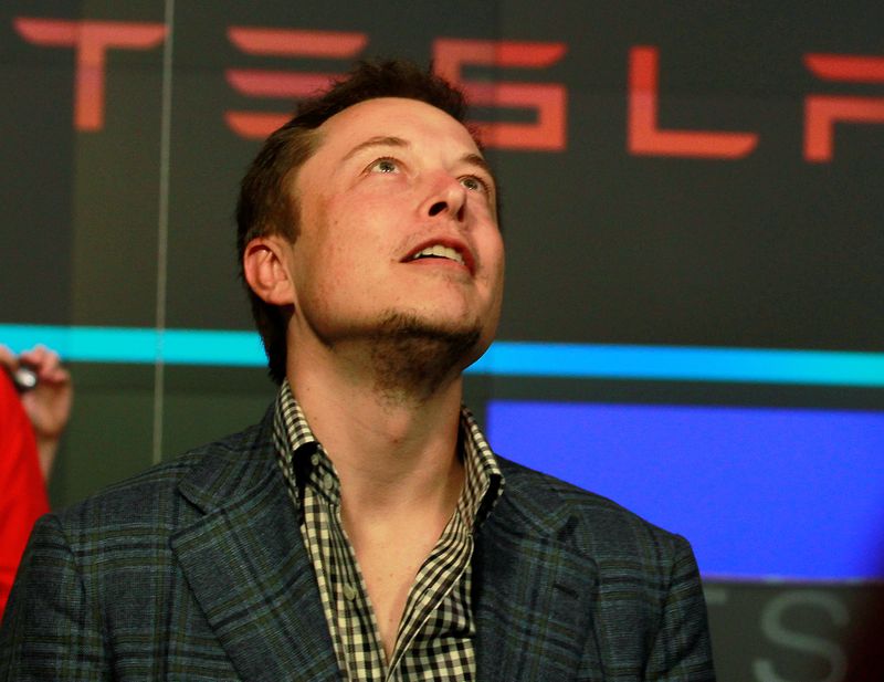 &copy; Reuters. FILE PHOTO: CEO of Tesla Motors Elon Musk reacts following the company&apos;s initial public offering at the NASDAQ market in New York