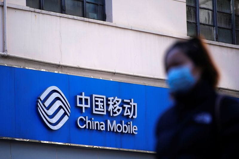 © Reuters. A sign of China Mobile is seen on a street, during the coronavirus disease (COVID-19) outbreak in Shanghai