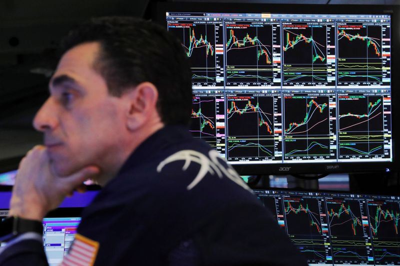 &copy; Reuters. FILE PHOTO: A trader at the New York Stock Exchange works as markets continue to react to the coronavirus disease (COVID-19) inside of the NYSE in New York