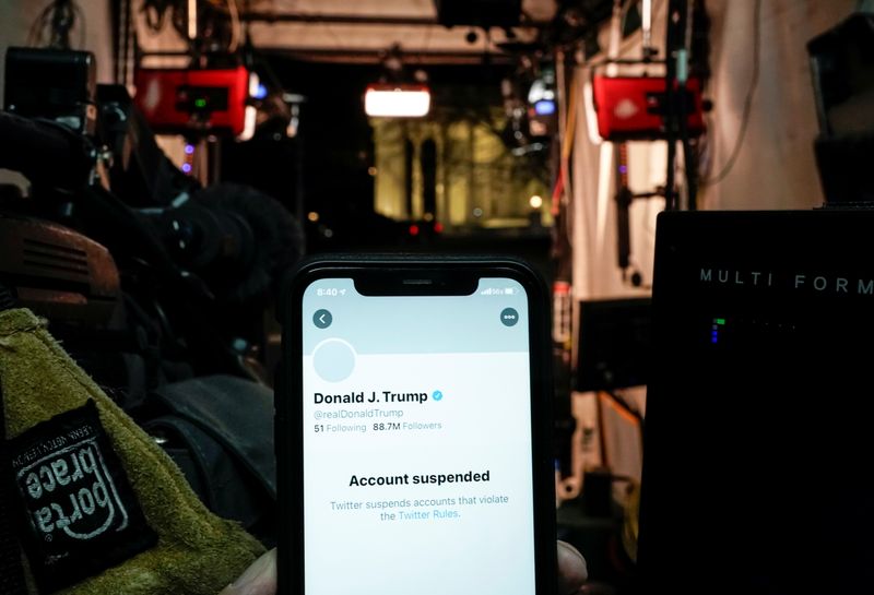 &copy; Reuters. A photo illustration shows the suspended Twitter account of U.S. President Donald Trump on a smartphone in a media board cast tent at the White House in Washington