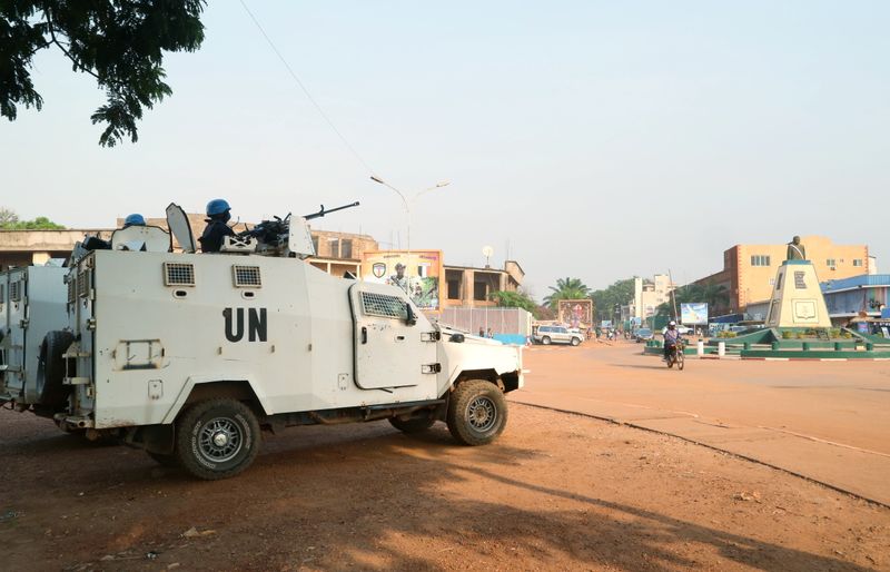 © Reuters. A MINUSCA armoured personnel carrier keep guard as they patrol the streets ahead of the upcoming elections in Bangui