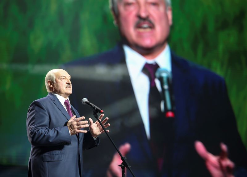 &copy; Reuters. Belarusian President Alexander Lukashenko speaks at the forum of Union of Women in Minsk