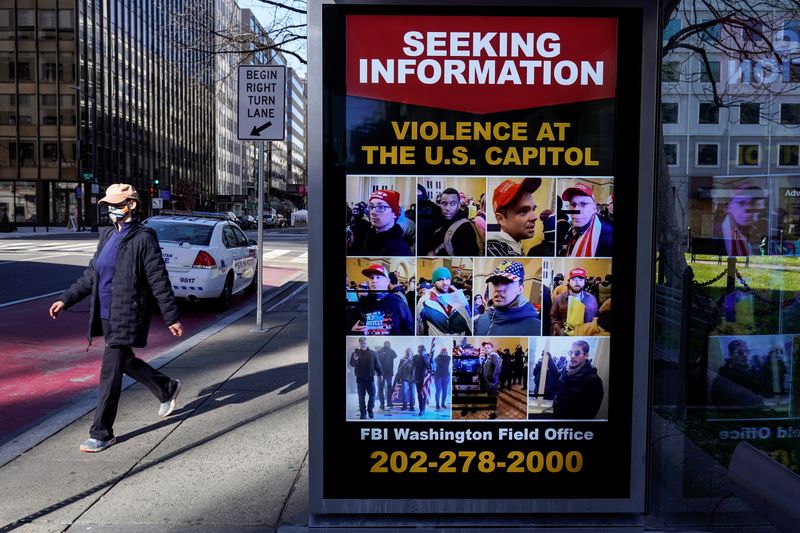 &copy; Reuters. A sign seeking information on Trump supporters who stormed the U.S. Capitol in posted in Washington