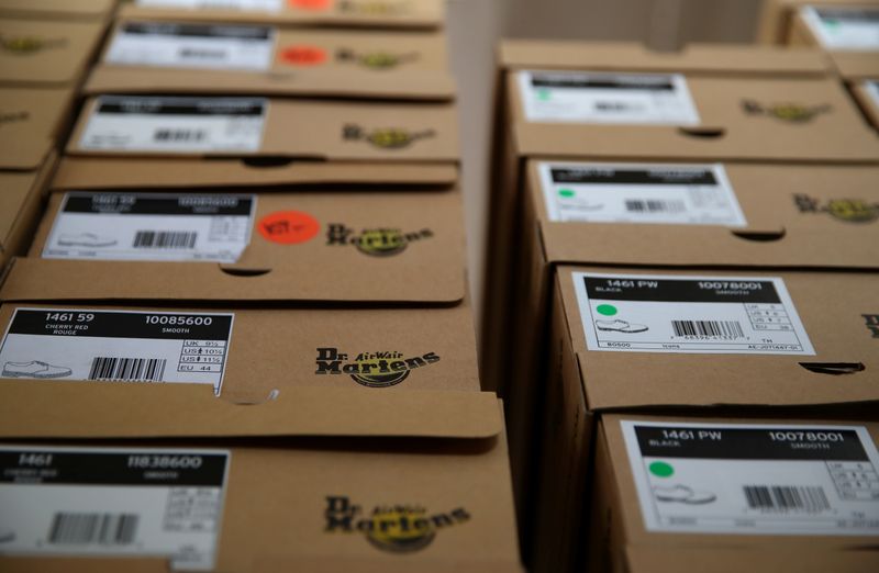 &copy; Reuters. Boxes of Dr. Martens shoes are pictured in the warehouse of local footwear retailer &quot;Pomp It Up&quot; in Bussigny