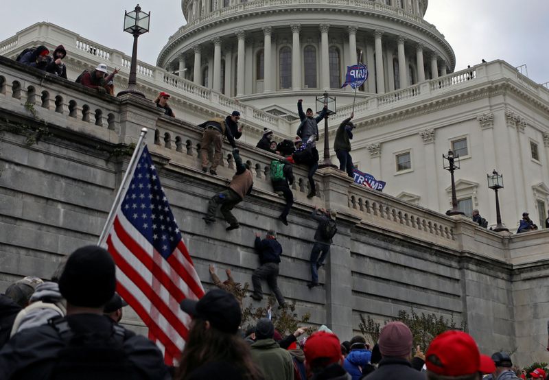 © Reuters. FILE PHOTO: Supporters of U.S. President Donald Trump protest outside the Capitol in Washington