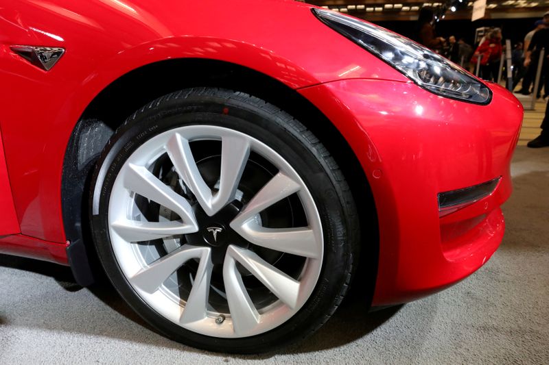 &copy; Reuters. FILE PHOTO: A Tesla Model 3 electric vehicle is displayed at the Canadian International Auto Show in Toronto