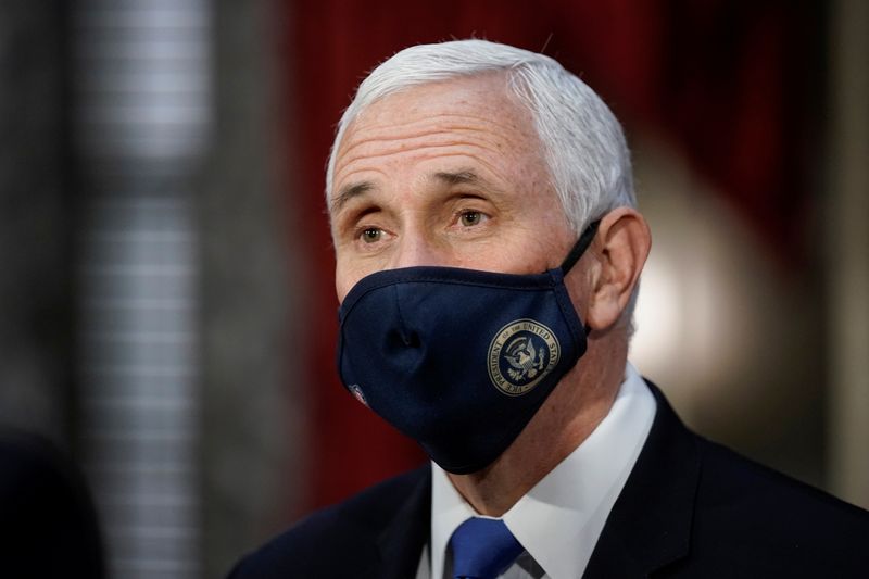 &copy; Reuters. FILE PHOTO:  Vice President Mike Pence finishes a swearing-in ceremony for Senators in the Old Senate Chamber at the Capitol in Washington