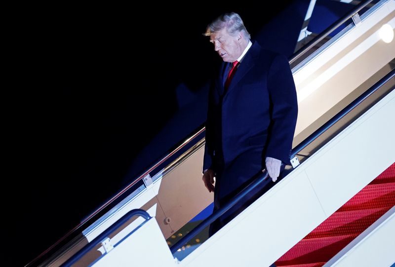 &copy; Reuters. U.S. President Donald Trump disembarks from Air Force One at Joint Base Andrews in Maryland