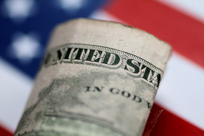 © Reuters. FILE PHOTO: Illustration photo of a U.S. five dollar note