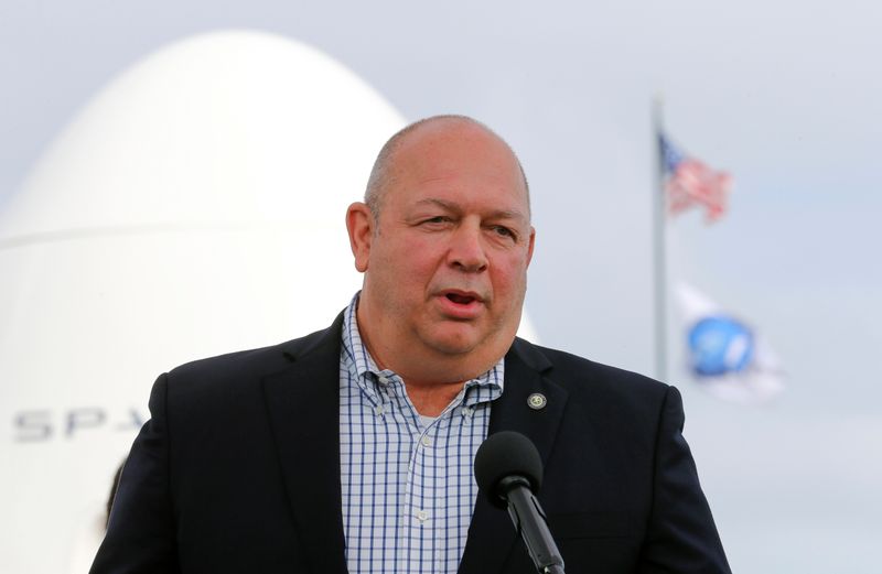© Reuters. FILE PHOTO: Federal Aviation Administration Administrator Steve Dickson speaks at a pre-launch news conference as a SpaceX Falcon 9 rocket is readied in Cape Canaveral