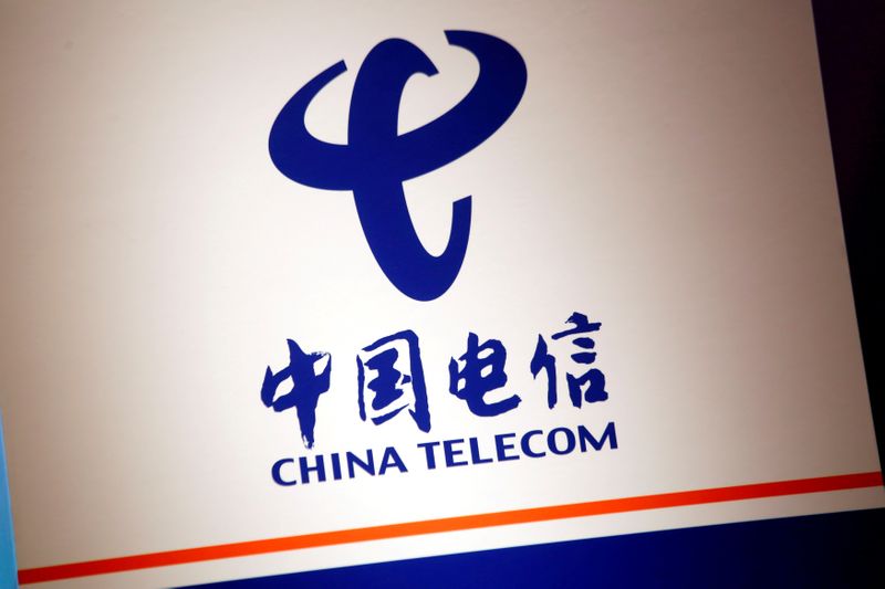 &copy; Reuters. FILE PHOTO: FILE PHOTO: The company logo of China Telecom is displayed at a news conference in Hong Kong