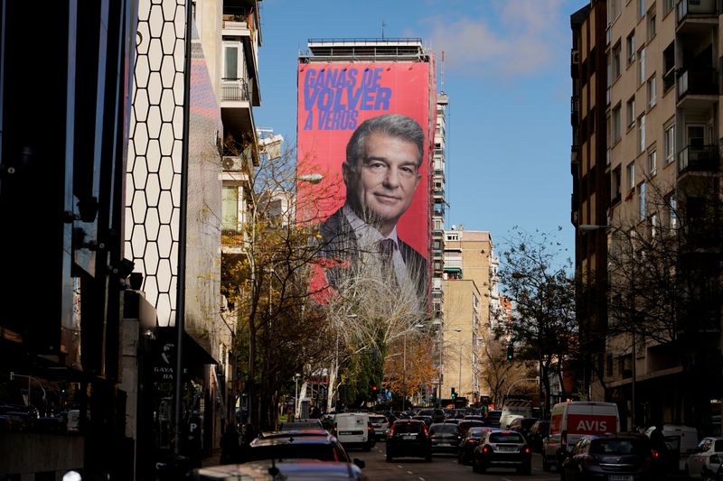 © Reuters. A giant electoral poster of FC Barcelona presidential hopeful Joan Laporta is seen on a building next to the Santiago Bernabeu Stadium in Madrid