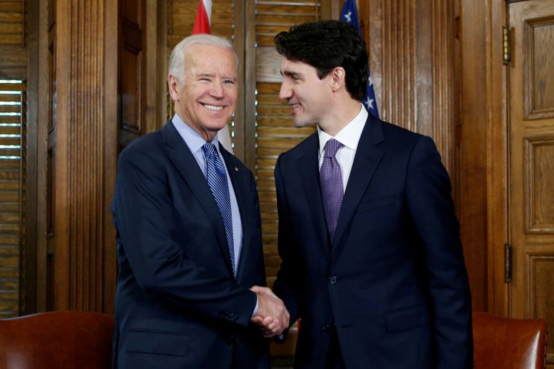 &copy; Reuters. FILE PHOTO: Canada&apos;s PM Trudeau shakes hands with U.S. Vice President Biden during a meeting in Trudeau&apos;s office on Parliament Hill in Ottawa