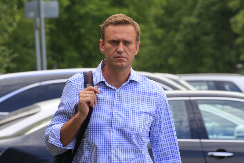&copy; Reuters. Russian opposition leader Navalny walks before a court hearing in Moscow
