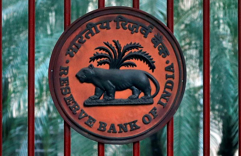 &copy; Reuters. FILE PHOTO: Reserve Bank of India logo is seen at the gate of its office in New Delhi