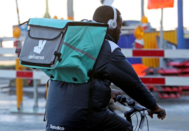 &copy; Reuters. A courier for food delivery service Deliveroo rides a bike in central Brussels