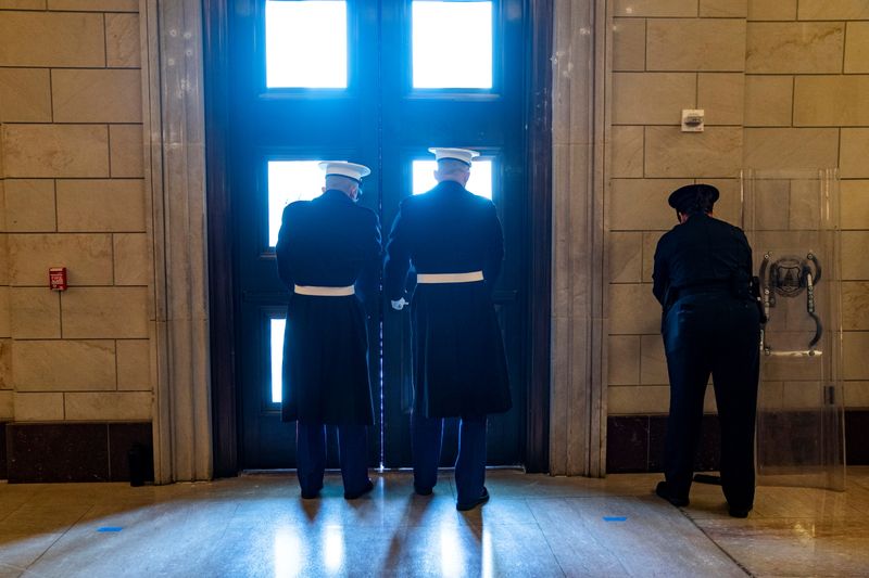 © Reuters. White House Marine sentries secure the East Front door of the U.S. Capitol