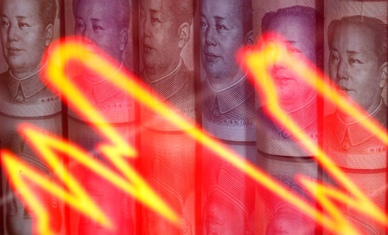 &copy; Reuters. FILE PHOTO: Chinese Yuan banknotes are seen behind illuminated stock graph in this illustration