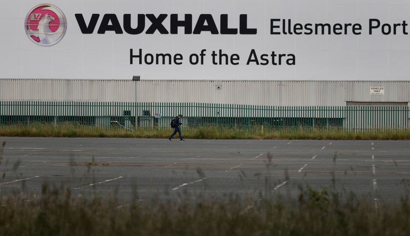 &copy; Reuters. A man walks across an empty car park at the Vauxhall car plant in Ellesmere Port