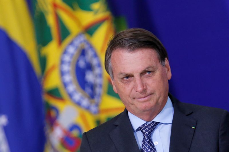 © Reuters. Brazil's President Jair Bolsonaro looks on during a ceremony at the Planalto Palace