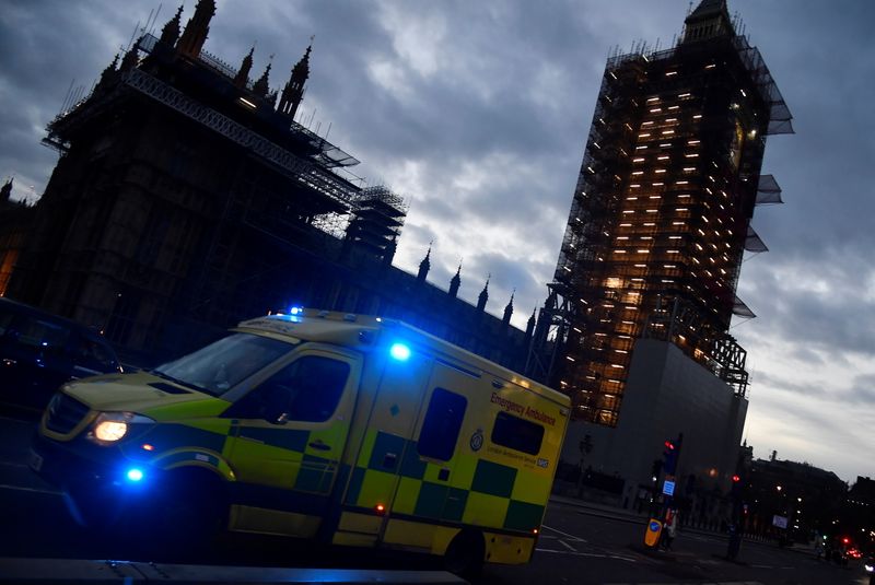 &copy; Reuters. An ambulance passes the Houses of Parliament as it crosses Westminster Bridge, amid the spread of the coronavirus disease (COVID-19) pandemic, in London