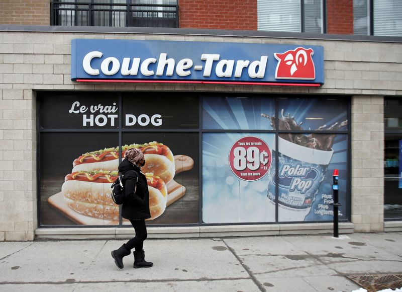 &copy; Reuters. A pedestrian walks past a Couche-Tard convenience store in Montreal