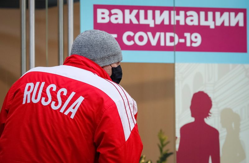 &copy; Reuters. A man stands outside a vaccination centre in the State Department Store, GUM, in Moscow